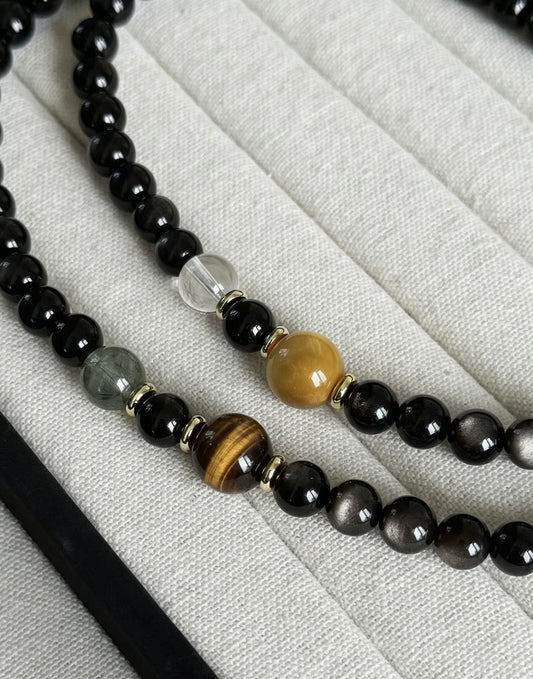 Amoria Natural Obsidian 7mm–8mm Double-Strand Bracelet: The obsidian shimmers like a starry sky and is accented with golden tiger's eye, creating a striking visual effect.