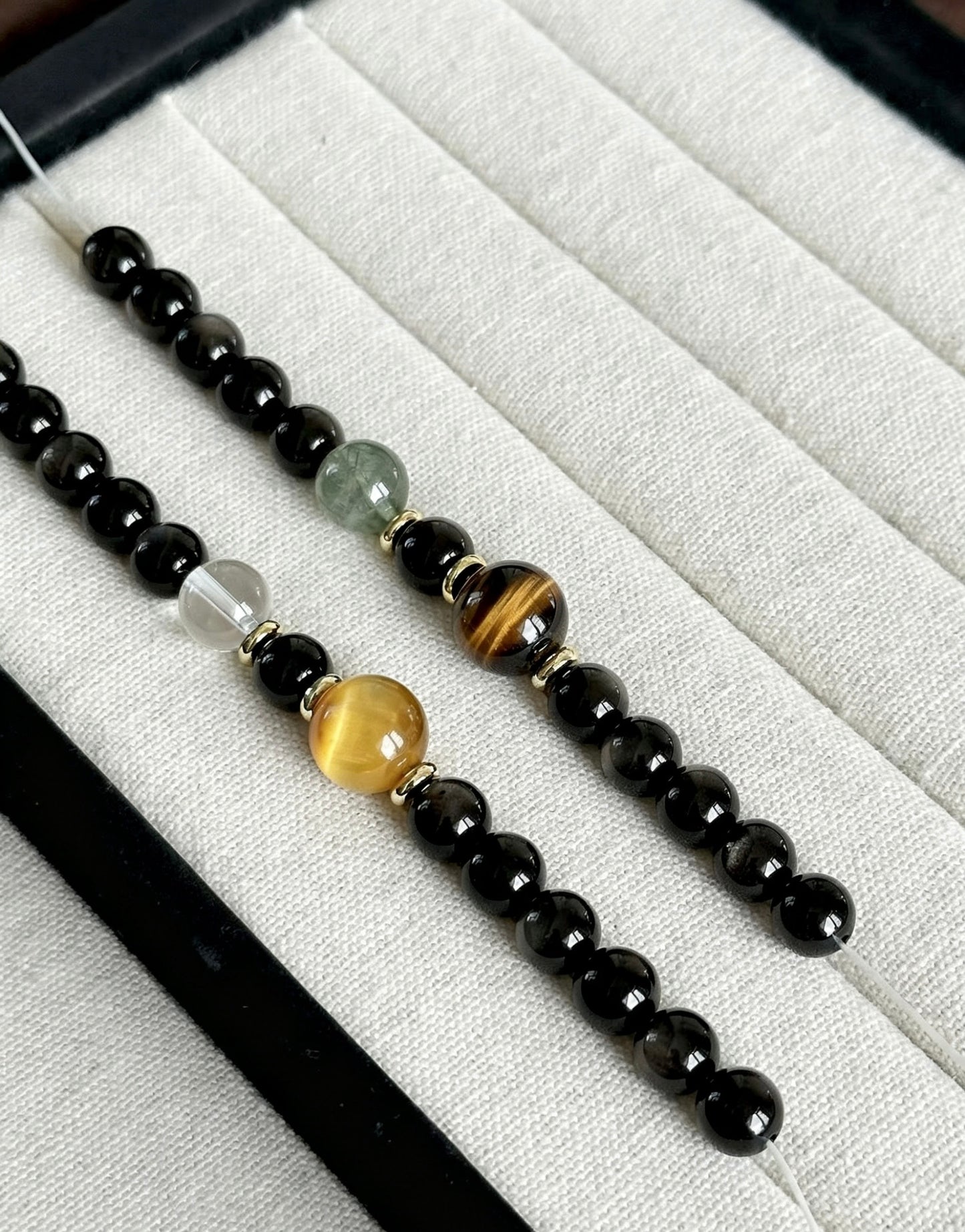 Amoria Natural Obsidian 7mm–8mm Double-Strand Bracelet: The obsidian shimmers like a starry sky and is accented with golden tiger's eye, creating a striking visual effect.